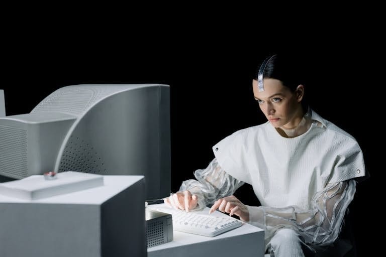 A woman in a futuristic setting working on an old computer, suggesting a blend of past and future.